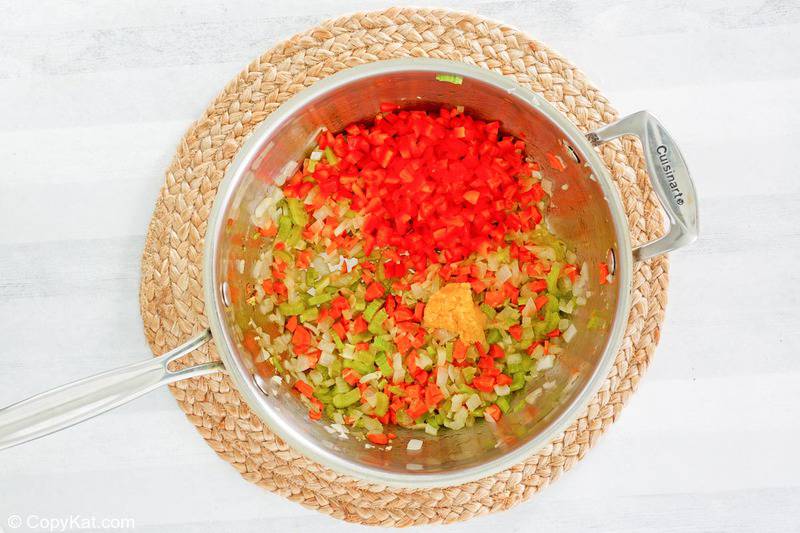 chopped vegetables for black bean soup in a pot
