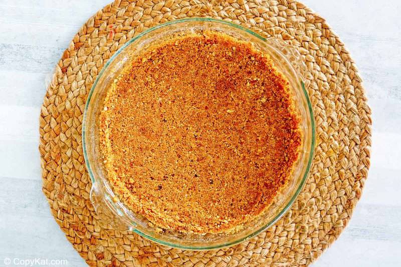 pecan graham cracker crust in a pie plate