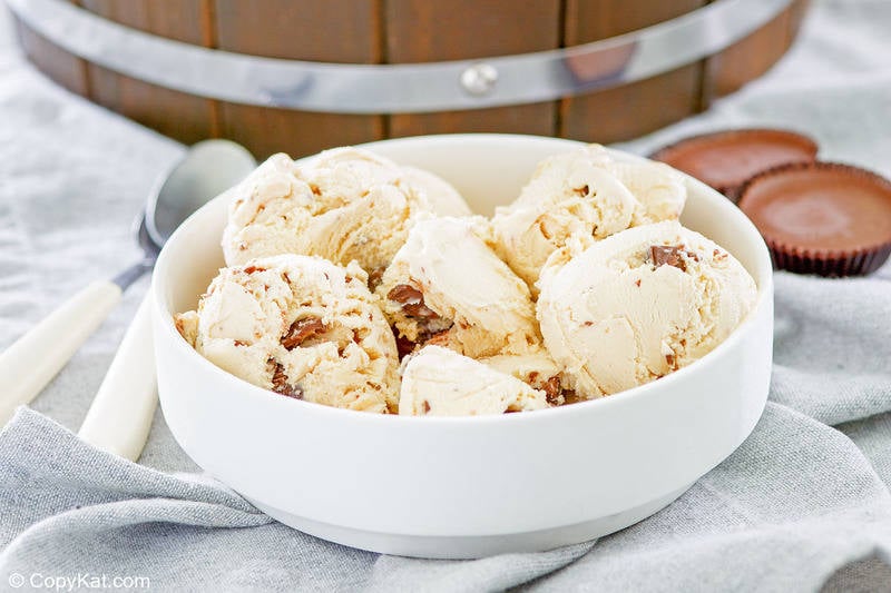 homemade peanut butter ice cream, peanut butter cups, and spoons