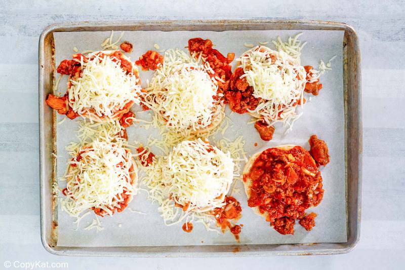 pizza burgers before being baked on a baking sheet