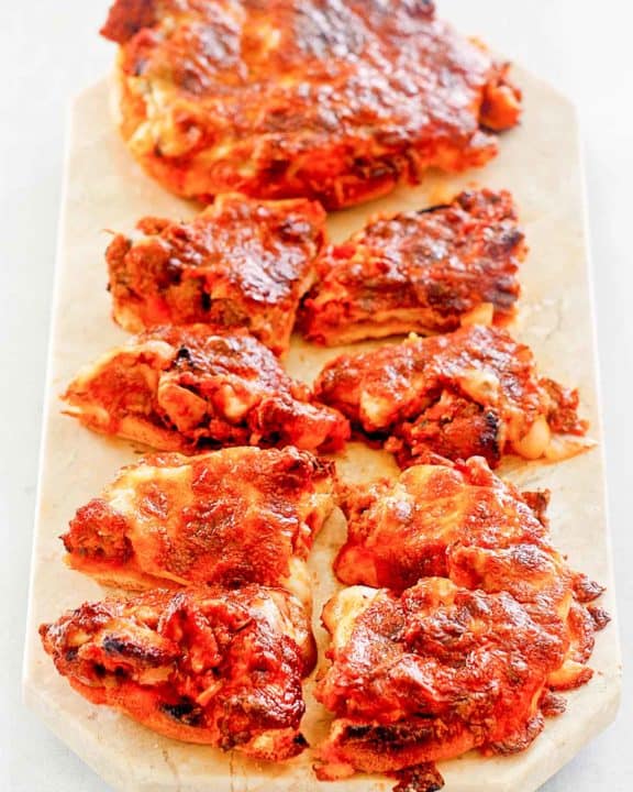 pizza burgers on a marble platter