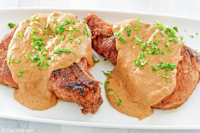 southern fried pork chops and gravy on a platter