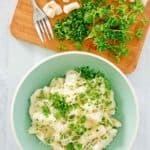 overhead view of homemade potato gnocchi and parsley