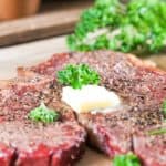 smoked steak topped with butter and parsley
