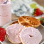 strawberry cream cheese spread on a bagel