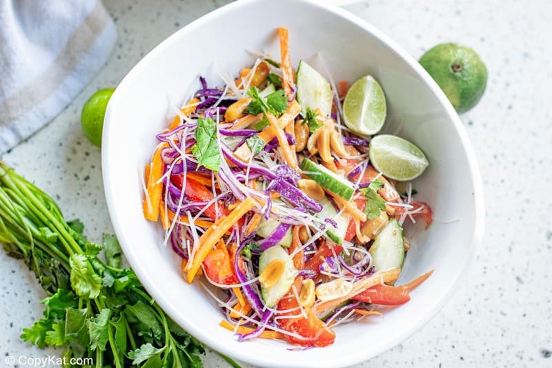 Thai noodle salad, limes, and fresh cilantro