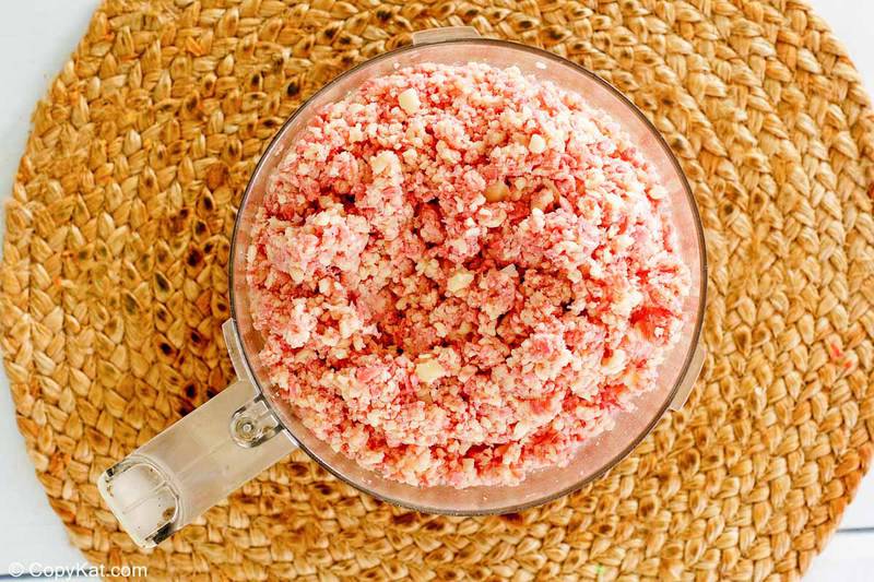 ground meat and cheese in a food processor bowl