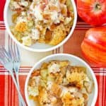 overhead view of two bowls of Bisquick apple cobbler, apples, and forks