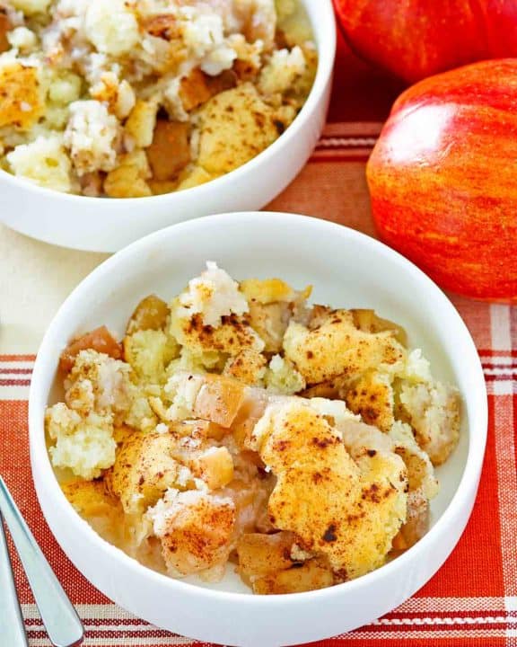 two apples and two bowls of Bisquick apple cobbler