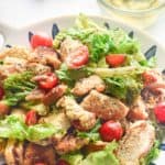 chicken Caesar salad in a colorful bowl