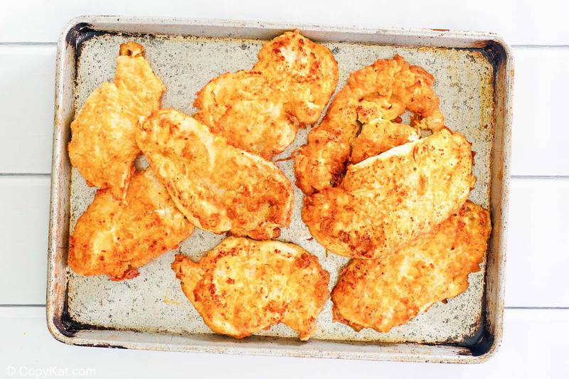 fried chicken cutlets on a baking sheet