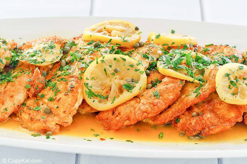 chicken francese with lemon slices on a platter