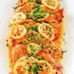 chicken francese and lemon slices on a platter