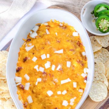 chili cheese dip, jalapeno pepper slices, and tortilla chips