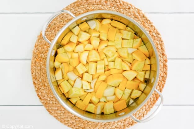 chopped yellow squash in a pan