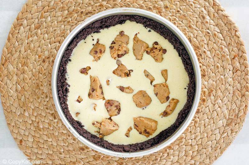 cookie dough cheesecake filling and crust in a springform pan