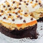 cookie dough cheesecake on a cake stand