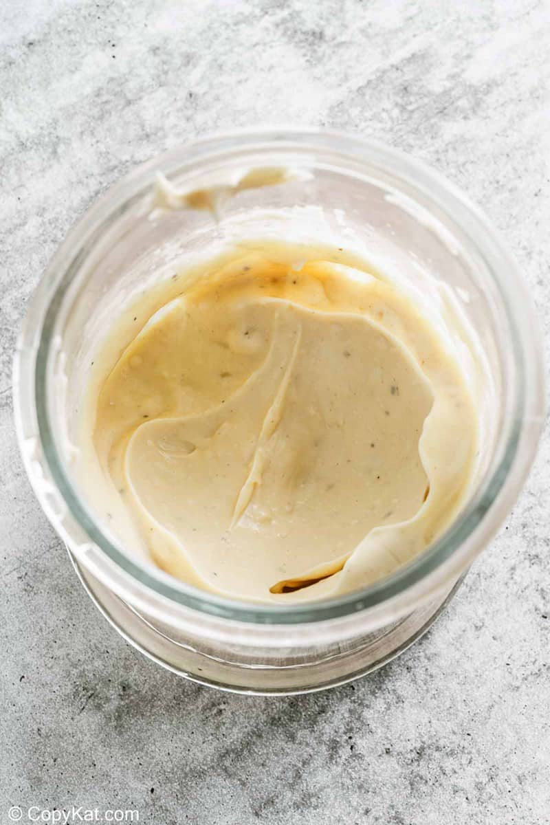 blended garlic aioli in an immersion blender cup