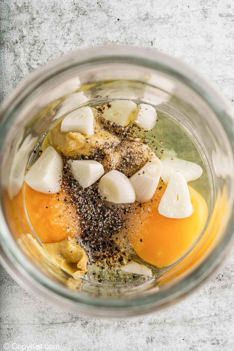 garlic aioli ingredients in an immersion blender container