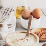 homemade garlic aioli, eggs, garlic bulbs, and oil