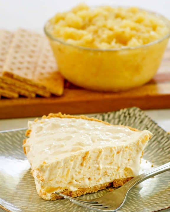 million dollar pie slice, bowl of crushed pineapple, and graham crackers