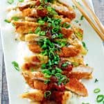 pork katsu, white rice, and chop sticks on a platter