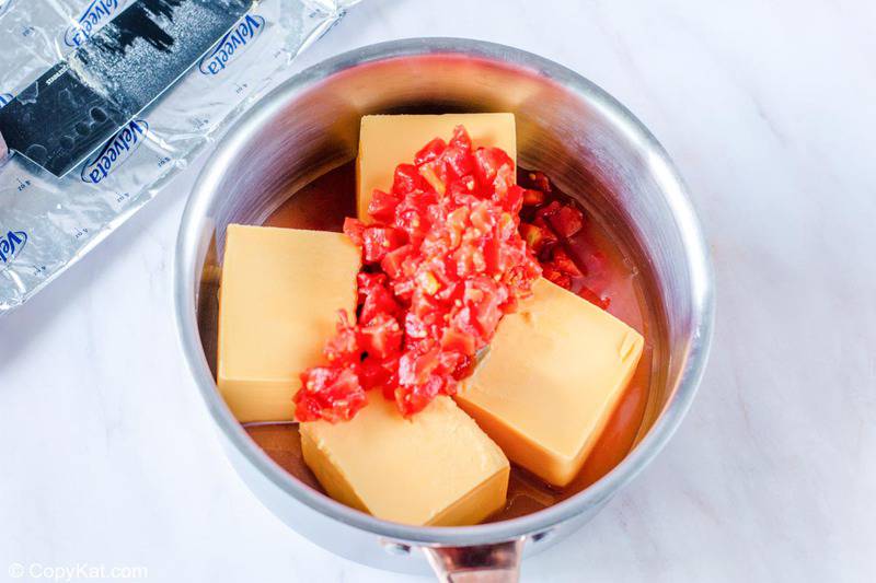 velveeta cheese and rotel tomatoes in a saucepan