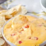 rotel dip with a tortilla chip in it