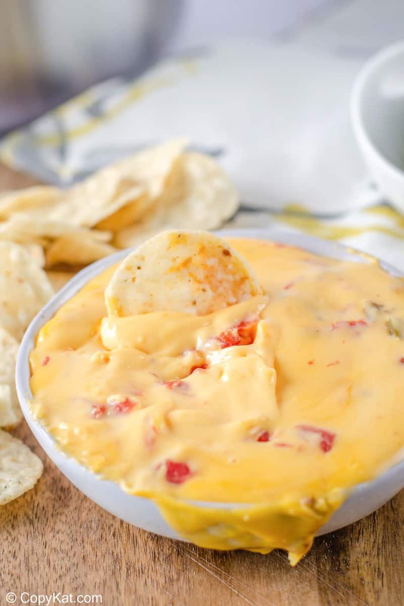 rotel dip with a tortilla chip in it
