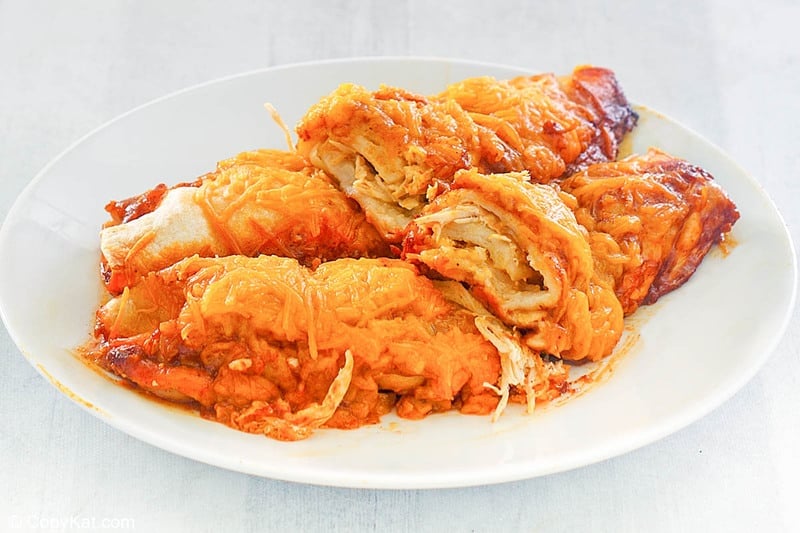 two sour cream chicken enchiladas on a plate