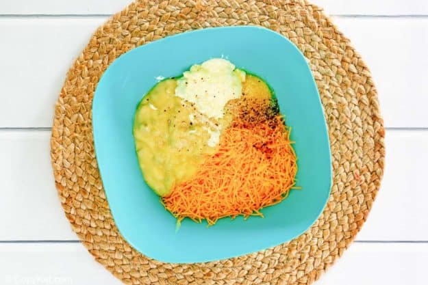 cheese and soup mixture for squash casserole in a bowl