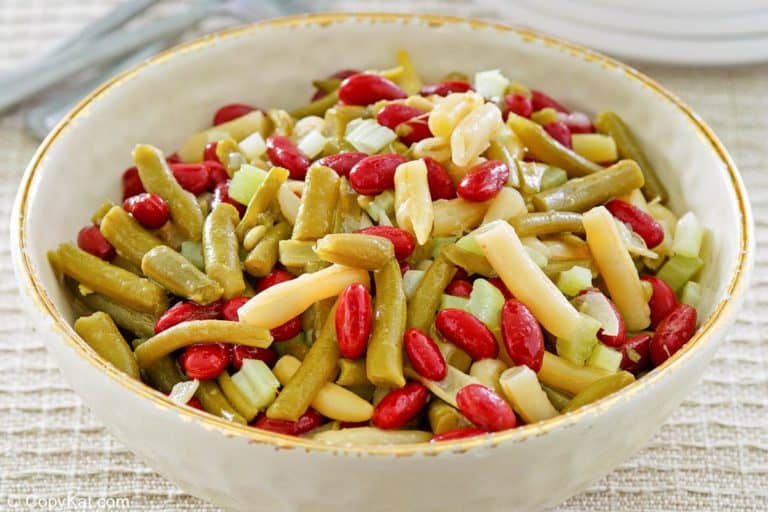 two bowls of homemade macaroni salad and three forks