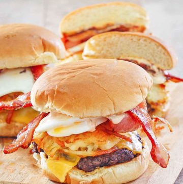 homemade Whataburger breakfast burgers on a wood board