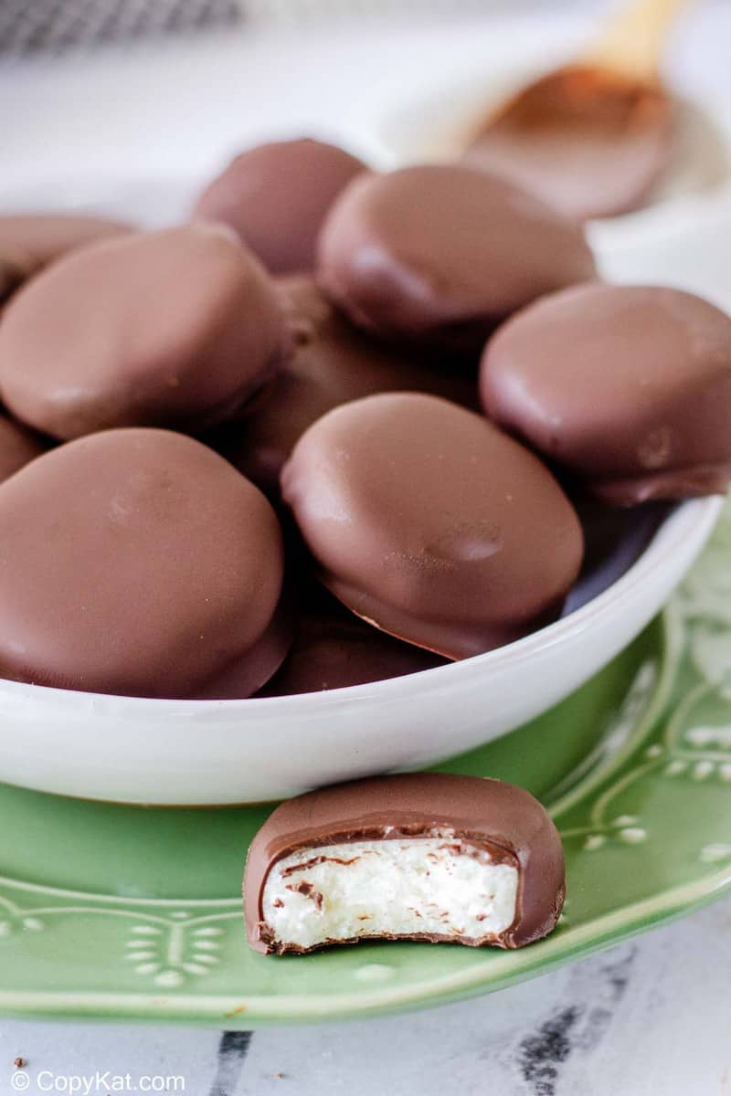 homemade York Peppermint Patties in a dish and one with a bite out of it