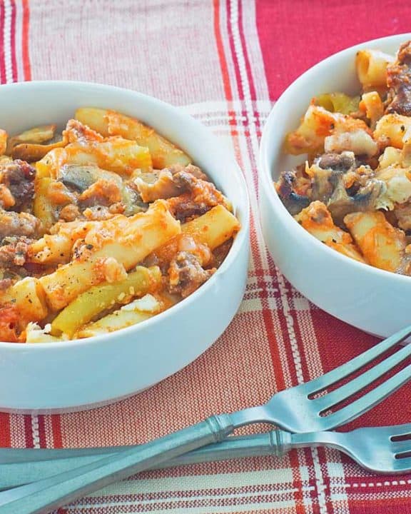 bowls of baked ziti and forks