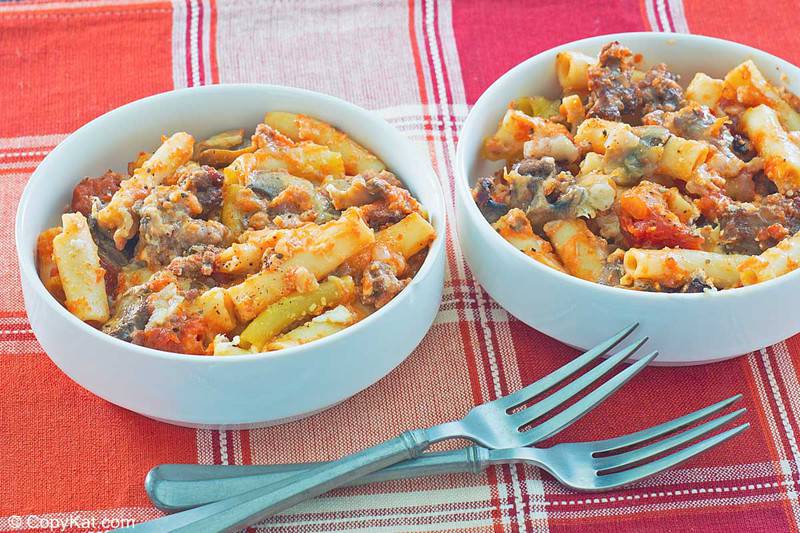 bowls of baked ziti and forks