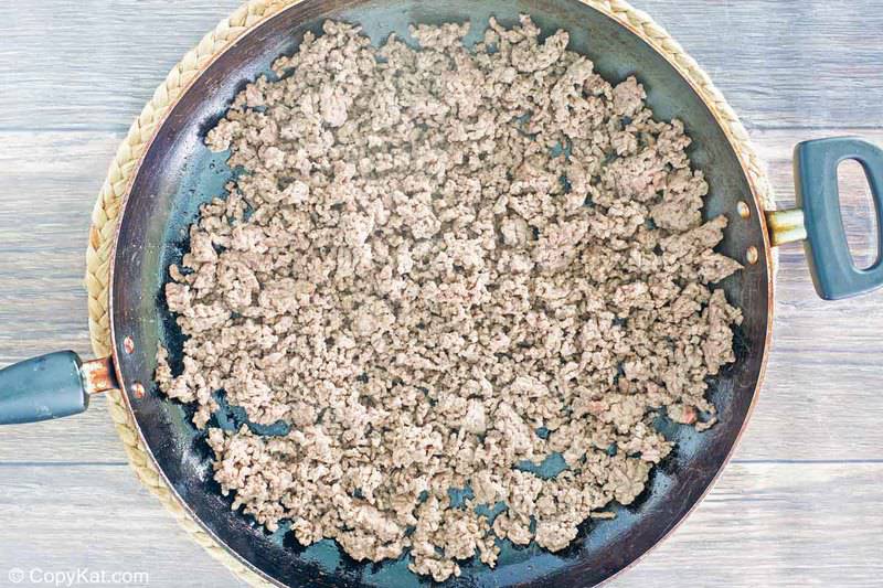 browned ground beef crumbles in a skillet