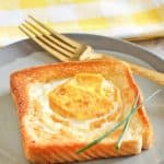 egg in a basket and a fork on a plate