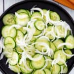 overhead view of cucumber onion salad in a bowl