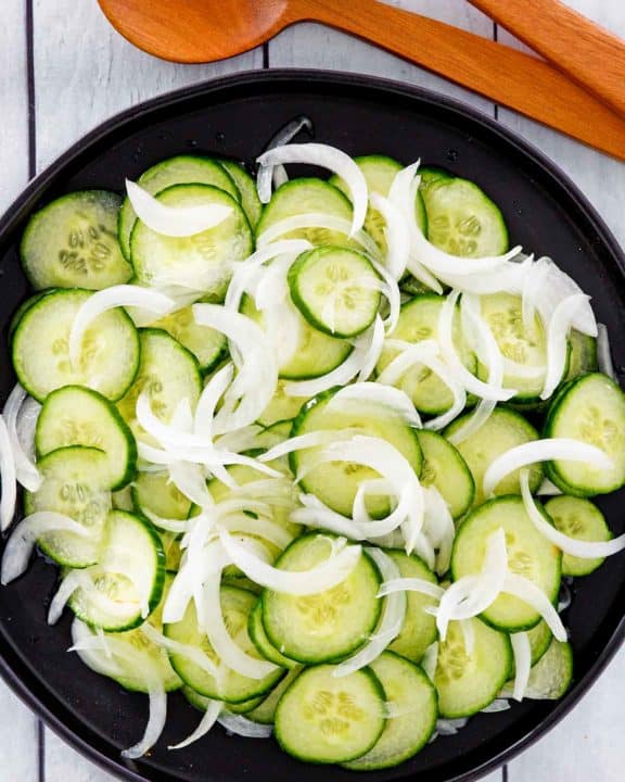 overhead view of cucumber onion salad in a bowl