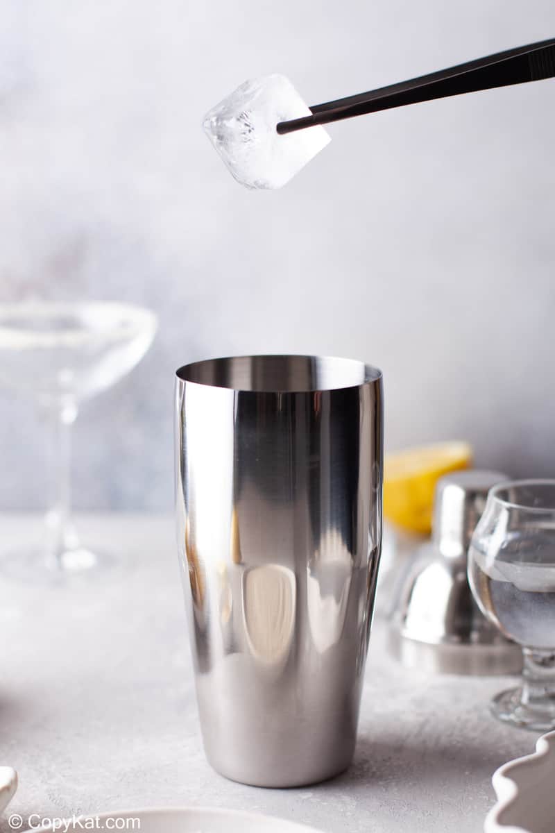 putting ice in a cocktail shaker