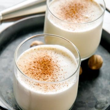 two glasses of milk punch on a tray