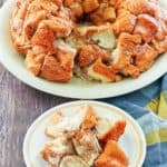 monkey bread on a platter and a serving on a plate