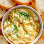 overhead view of homemade Olive Garden angry alfredo with chicken in a bowl and bread slices