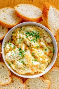 overhead view of homemade Olive Garden angry alfredo with chicken in a bowl and bread slices