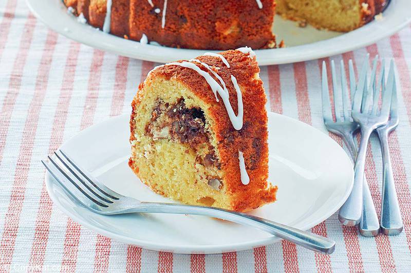 a slice of sock it to me cake on a plate and forks next to it
