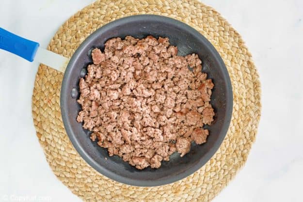 browned ground beef in a skillet.