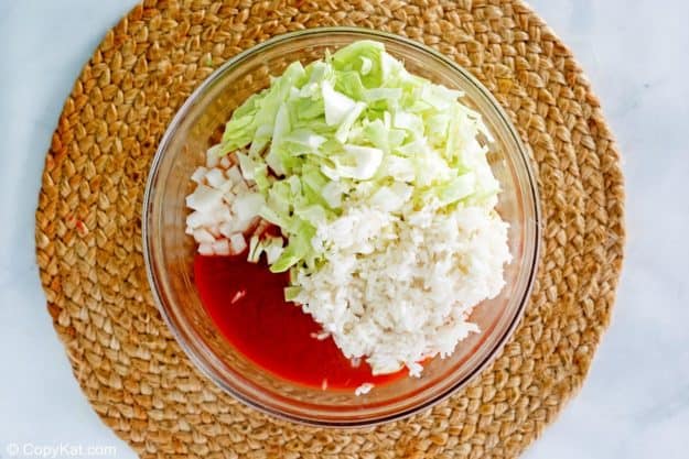 cabbage roll casserole ingredients in a mixing bowl.