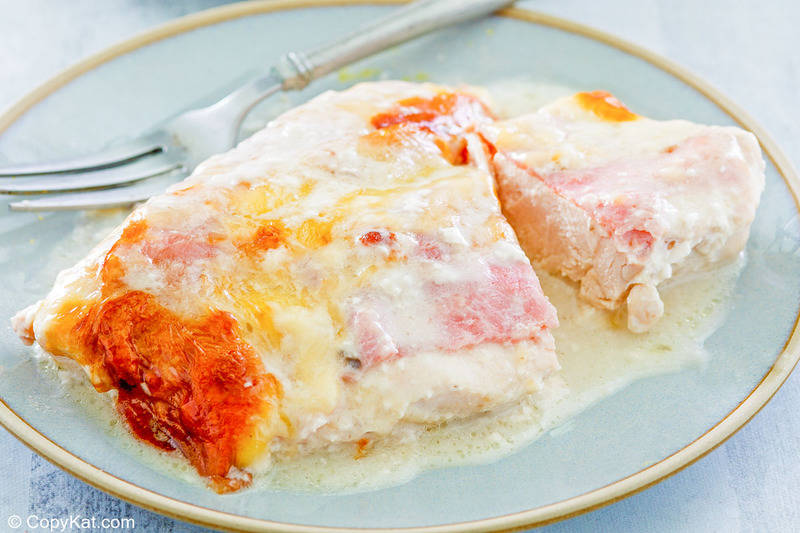 a serving of chicken cordon bleu casserole and a fork on a plate.