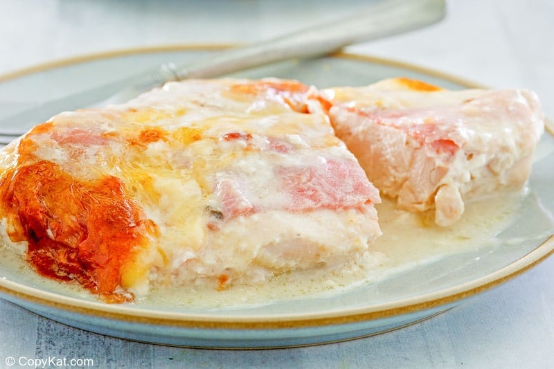 chicken cordon bleu casserole serving and a fork on a plate